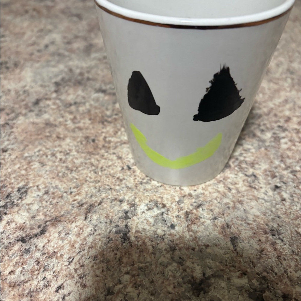 White Cup with Black and Green Smiley Face
